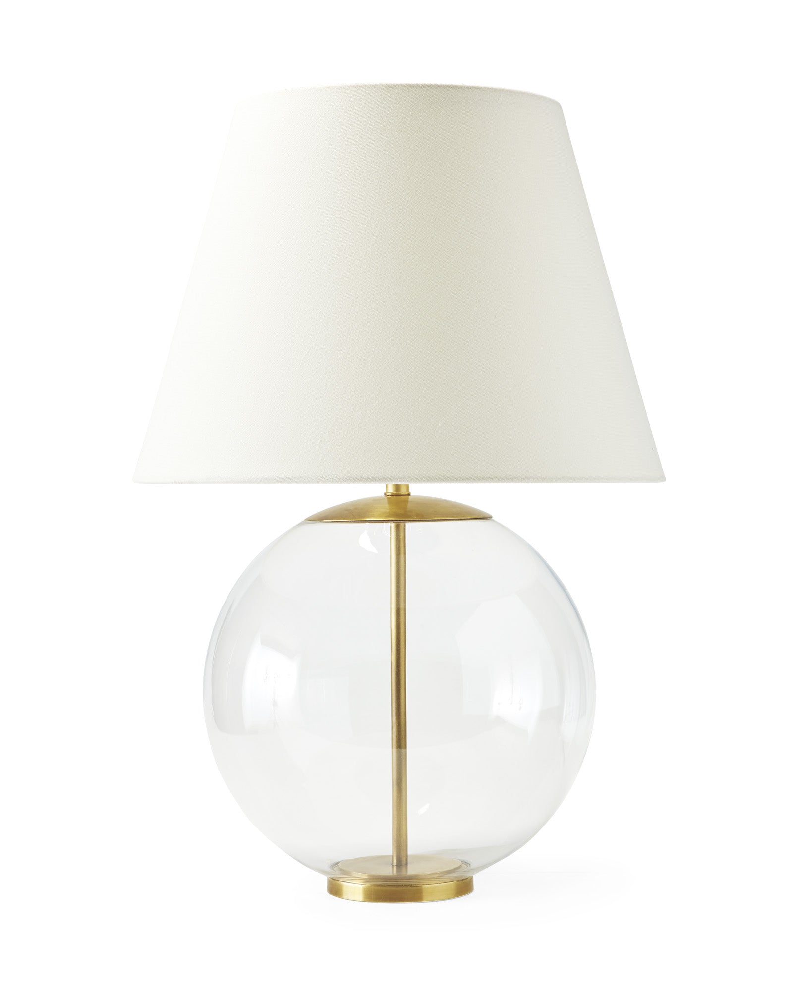 Золотая настольная лампа "Клейтон" в форме стеклянного шара на стальной подставке.